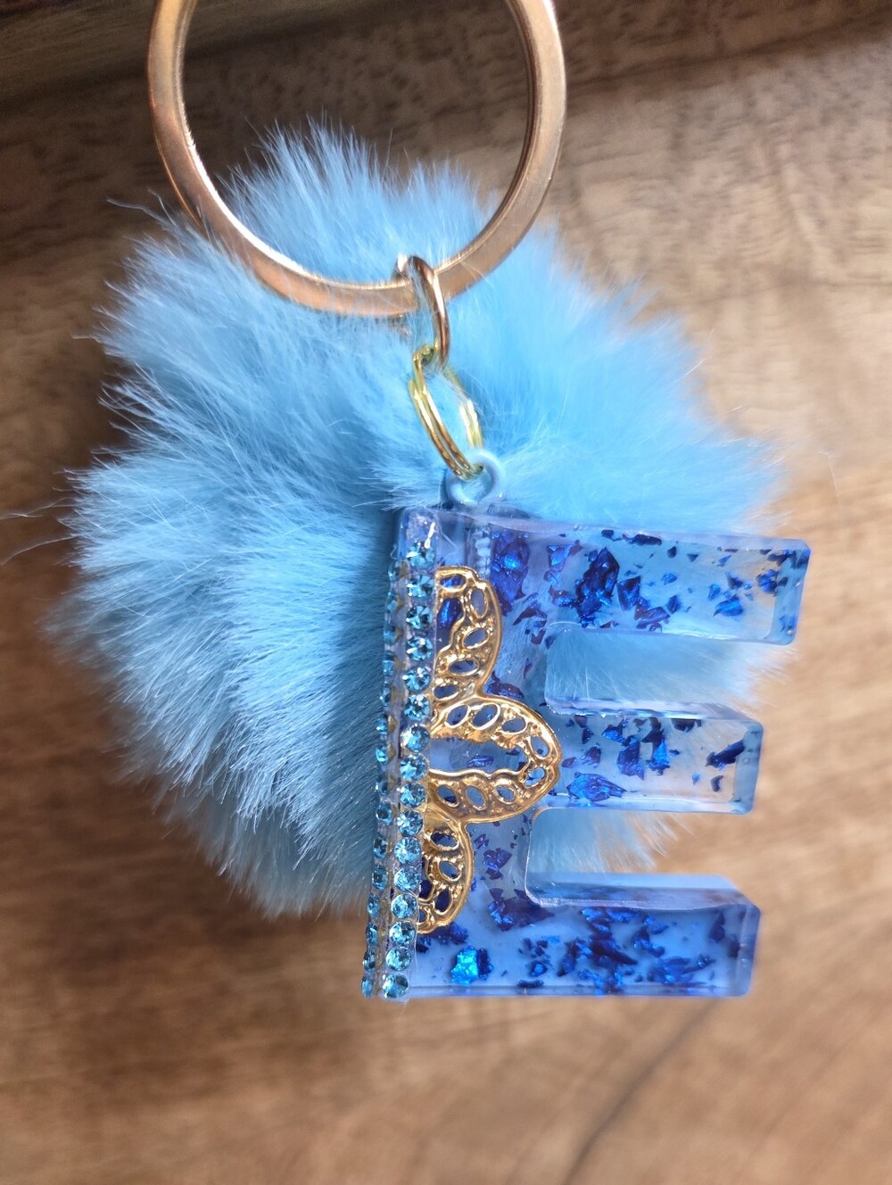 Handmade Blue Resin 'E' Keychain with Fluffy Pom